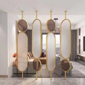 Anat Verona decorative freestanding room partition with a gold stainless steel frame and semi-transparent panels of vertical fluted/reeded glass. Luxury glass divider available near Ambala, Haryana, and across India.