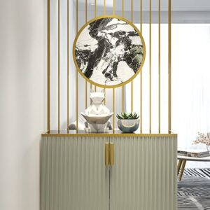 Anat Aria luxury storage cabinet with reeded/fluted light grey doors and gold handles, topped by a built-in vertical gold stainless steel partition and a circular black and white marble wall accent. Luxury furniture available near Ambala, Haryana, and across India.