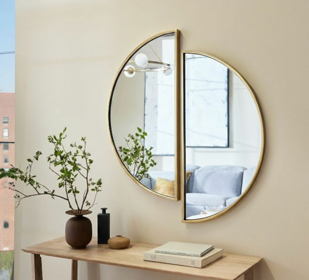 Half circle modern designer wall mirror with golden frame mounted above a console table available near Ambala, Haryana, and across India.